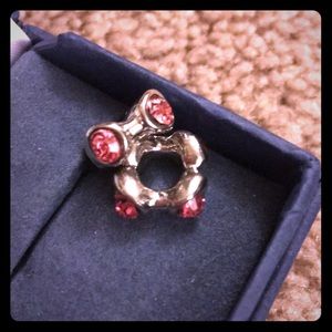 Pink Crystal and silver square shaped.